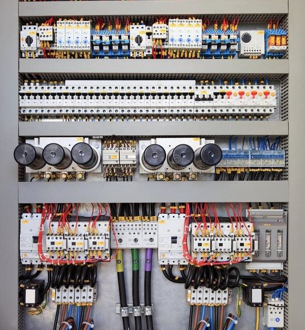 Photo about Electrical panel at a assembly line…